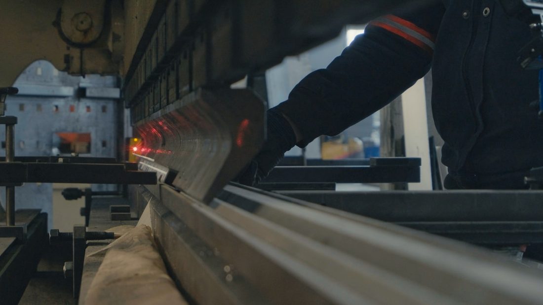 Factory worker operating industrial equipment